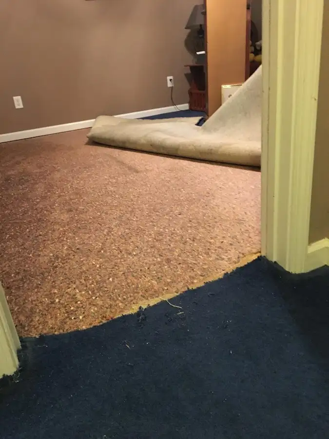 Carpet pad removal revealing water damage during Drying & Dehumidification in Round Rock